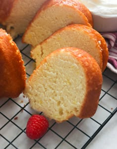 the bundt cake has been cut in half and is ready to be eaten with raspberries