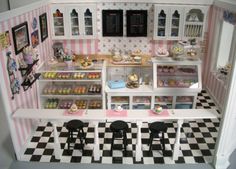 a dollhouse with black and white checkered flooring on the walls, windows, and shelves