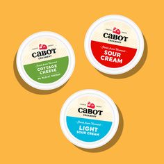 three yogurts are shown on a yellow background with the words, cabot and sour cream