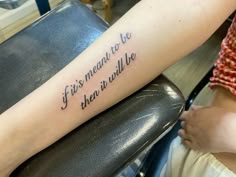 a woman with a tattoo on her arm that says if it's meant to be when it will be