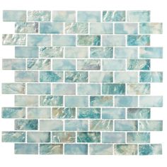 a white and blue mosaic tile wall