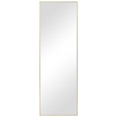 a mirror that is standing up against a white wall and gold trimming on it