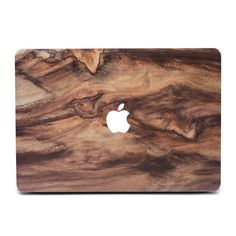 an apple macbook pro with wood skin