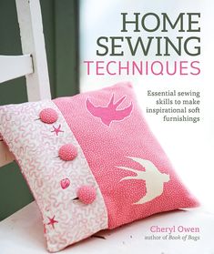 the cover of home sewing techniques, featuring pink and white pillows with buttons on them