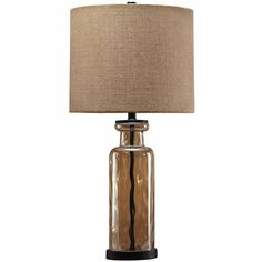 a table lamp with a brown shade on it