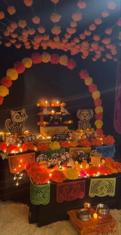 an altar with candles and decorations on it