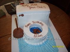 a birthday cake that is shaped like a toilet