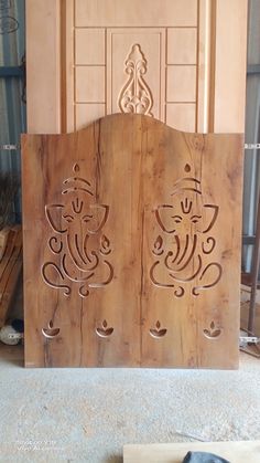 a wooden door with carvings on it