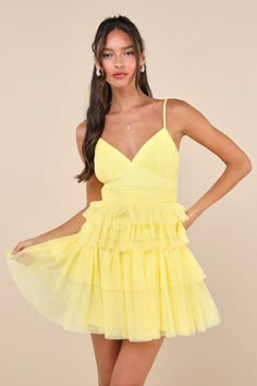 An attention-worthy look like the Lulus Special Poise Yellow Tulle Pleated Sleeveless Tiered Mini Dress will have everyone in awe all night long! Layers of sheer tulle mesh shape this iconic dress that features a pleated, sleeveless bodice, a flirty V-neckline, and adjustable spaghetti straps. A flattering, set-in waist sits atop a flouncy, tiered skirt that finishes at an alluring mini hem. Hidden back zipper/clasp. Fit: This garment fits true to size. Length: Mid-thigh. Size medium measures 26 Yellow Fringe Dress, Yellow Short Formal Dress, Winterball Dresses Short, Chiffon Homecoming Dress, Fluffy Hoco Dresses, Spring Dresses With Spaghetti Straps And Tulle Skirt, Sleeveless Mesh Dress With Ruffles For Summer, Sleeveless Summer Mesh Dress With Ruffles, Summer Sleeveless Mesh Dress With Ruffles