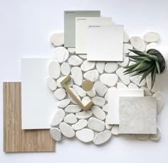 various materials are arranged on top of each other, including white rocks and wood planks