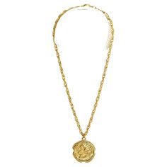 Chanel Haute Couture necklace in gold metal composed of a twisted mesh chain and a large medallion shaped with the motif of a "Greek profile" on one side and a crown signed Chanel on the other. Total length of the chain (open) 43 cm, diameter of the medallion 3.5 cm. The necklace is vintage, in very good condition, chic and bourgeois, magnificent. Medallion Necklace With Gold Chain, Metal Medallion Necklace With Gold Chain, Couture Necklace, Chanel Haute Couture, Chains Necklace, Gold Metal, Jewelry Necklaces, Chanel, Couture