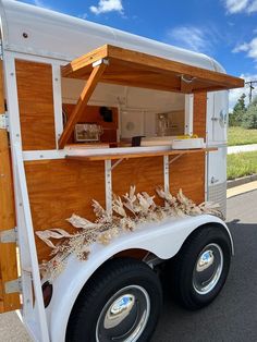 a food truck is parked on the side of the road