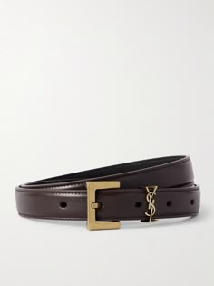 Find SAINT LAURENT Cassandre Leather Belt on Editorialist. The prong on SAINT LAURENT's 'Cassandre' belt is delicately carved to form the house's iconic 'YSL' monogram. It's been made in Italy from soft leather and cut in a slim 2cm width that'll work well with skinny jeans. Designer Belt Outfit, Ysl Clothing, Clothes Collage, Woman Belt, Belts Vintage, Rich Aunt, Ysl Belt, Closet Wishlist, Winter Work Wear