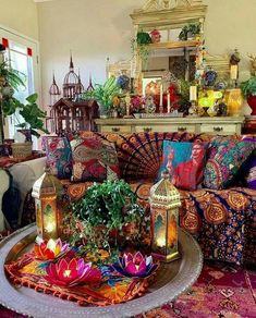 a living room filled with lots of colorful furniture and decorating items on top of a rug