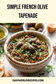 a bowl full of soup with olives and bread on the side text reads simple french olive tapenad