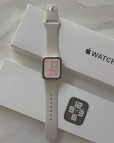 an apple watch sitting on top of a box