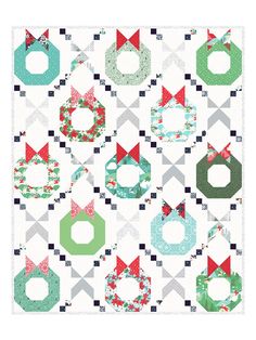 an image of a quilted christmas pattern with bows and wreaths on the front