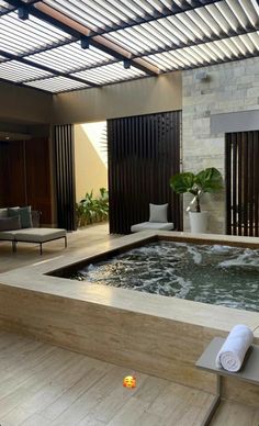 an indoor jacuzzi is shown in the living room