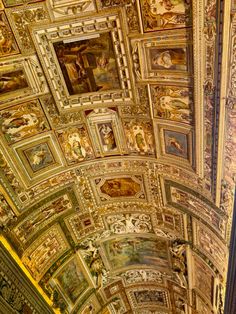 an ornate ceiling with many paintings on it