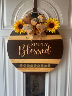 a wooden sign that says simply blessed with sunflowers