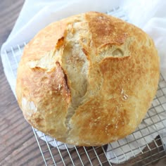 a loaf of bread sitting on top of a cooling rack