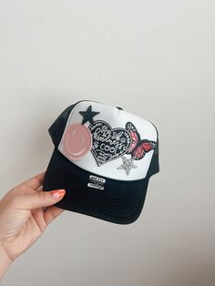 This custom made trucker patch hat is perfect for any occasion whether it be for spring/summer time, a lake hat, a gift for someone, or just a cute accessory to add a little spice to your outfit 🧢✨ DETAILS-  * This hat is one size with an adjustable SnapBack that is adjustable from 20in. - 23.5in. * The color of this hat is White * The material of the hat is polyester with iron on patches  REFUNDS AND CANCELLATIONS- Every hat is handmade by me as a result, a slight variation can occur from the picture with patch size or placement. If you have any problems with your hat please message me within 24 hours of receiving your order and I'd be happy to help! No refunds or exchanges will be accepted after. CONNECT- To enter giveaways, discount codes, or behind the scenes, follow our pages. 📲 Dia Trendy Adjustable Trucker Hat With Patches, Trucker Patch Hat Ideas, Trendy Summer Trucker Hat With Embroidered Patch, Trucker Style Baseball Cap With Patches, Trucker Hat With Patches For Streetwear, Trendy Baseball Cap With Patches And Curved Brim, Adjustable Snapback Trucker Hat With Patches, Streetwear Trucker Hat With Patches, Retro Spring Bucket Trucker Hat