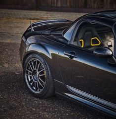 a black sports car parked on the street