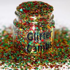 a jar filled with glitter sitting on top of a table