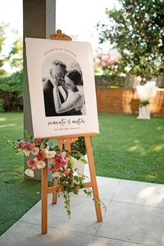 an easel with a wedding photo on it