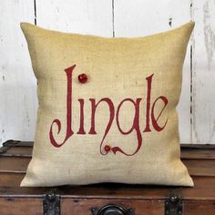 a pillow sitting on top of an old trunk with the word linggle printed on it