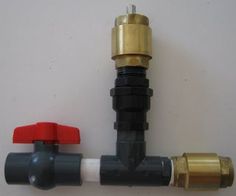 two different types of water valves on a white wall with red and black handles, one for the faucet