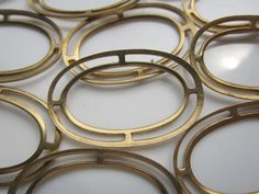 an array of metal circles on a white surface