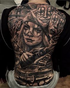 a woman with tattoos on her back