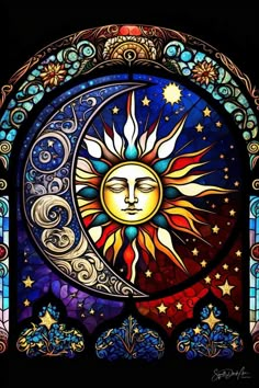 a stained glass window with the sun and moon in it's center, surrounded by stars