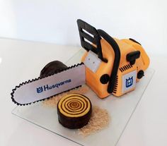 a cake made to look like a chainsaw and some food on top of it