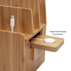 an apple watch charger is attached to a wooden stand with two charging cords on it