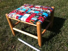 a small wooden chair with colorful fabric on it