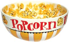 a bowl filled with popcorn sitting on top of a table