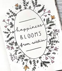 a card with the words, happiness blooms from within on it and an illustration of flowers