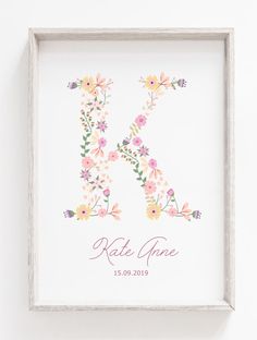 the letter k is made up of flowers in pink, yellow and orange on a white background