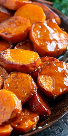 sweet potatoes covered in bbq sauce on a plate