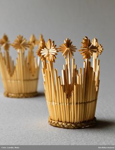 three small wooden objects sitting on top of a table