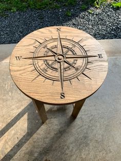 a wooden table with a compass design on it