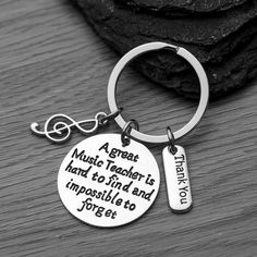 a keychain with a quote on it that says, a great music teacher is hard to find and impossible to forget