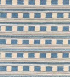 a blue and white striped rug