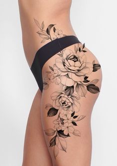 a woman's thigh with flowers on it