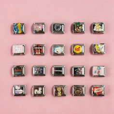 a bunch of different types of magnets on a pink surface