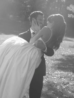 a man in a suit carrying a woman on his back