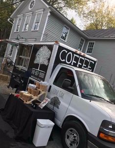 a coffee truck parked in front of a house