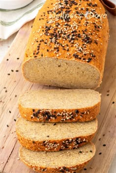 sliced loaf of bread with sesame seeds on top